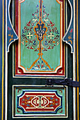 painted door inside a riad, Marrakech, Morocco
