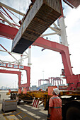 Loading of a container on a truck at harbor, Port of Tianjin, Tianjin, China