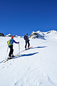 Two back-country skiers ascending to Piz Lagrev, Oberhalbstein Alps, Engadin, Canto of Graubuende, Switzerland