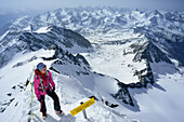 Woman ascending to Grossglockner, Glockner Group, High Tauern National Park, East Tyrol, Tyrol, Austria
