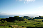 View across lush hills and coastline, near Ribeirinha, Sao Miguel island, Azores, Portugal, Europe
