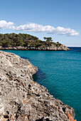 Rocky coastline of Cala Mondrago bay in Parc Natural de Mondrago, near Portopetro, Mallorca, Balearic Islands, Spain