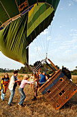People climbing into the basket of a hot air balloon, near Manacor, Mallorca, Balearic Islands, Spain, Europe