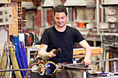 A glassblower displaying his craft in the Murano Glass Factory Ellegi Glas, Murano, near Venice, Veneto, Italy, Europe