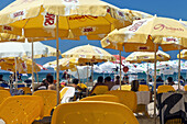 Yellow beach chairs and umbrellas on the beaches of Tel-Aviv, Israel, Asia