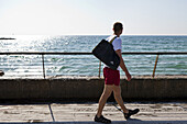 Man walking along the port looking out to the Mediterranean Sea, Tel-Aviv, Israel, Asia