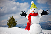 Snowman wearing cap, scarf and gloves, Kreischberg, Murau, Styria, Austria