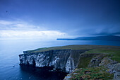 Summer storm approaching the island to the cliffs of Noss in the Shetland Islands , North Sea, Scotland