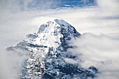 The summit of Eiger, over the clouds, Bernese Oberland, Swiss alps