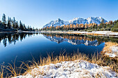 The reflection of mounts Braccia and Senevedo in the Lake Entova in the autumn season, Valmalenco, Sondrio, Lombardy, Italy