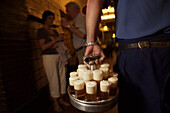 Beer is carried to tables at the popular Cologne pub Paffgen, where they brew and serve their Kolsch beer.