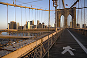 The pedestrian walkway over the Brooklyn Bridge is deserted in the early morning.  New York City, NY, May 13, 2008