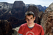 Alex Honnold stands on top of Moonlight Buttress in Zion National Park, UT after making the first free solo of the route graded IV 5.13a. His accomplishment is widely considered one of the hardest free solos ever done.