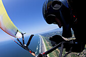 Maren Ludwig paragliding over Sunset Beach near Seaside, Oregon.