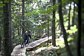 Mountain bikers make their way downhill on lift serviced biking trails at Sunday River Ski Resort in Bethel, Maine.