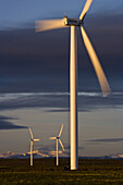 Wind turbines and the High Uinta Mountains at a wind farm in Southern Wyoming.