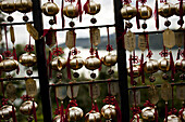 Bells and plates with inscribed blessings and wishes line the steps down to to Sun Moon Lake in West Central Taiwan, October 21, 2010.  Visitors first go to Wunwu Temple and buy wind chimes for their specific animal of the Chinese zodiac, and then have th