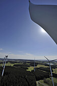 The view from the top of a wind turbine overlooking many others at a wind farm in Germany.