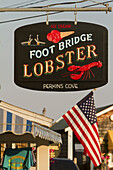 Lobster and Ice cream are advertised on a merchant's sign at Perkins Cove in Ogunquit, Maine.