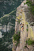 A woman climbs a lader at a via ferrata in the Copper Canyon Adventure Park in Chihuahua,  Mexico