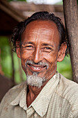 Bandarban,  Bangladesh - July 2011: Portrait of man in the Chittagong hill tracts near Bandarban Bangladesh.