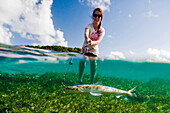 Elizabeth Hurd makes the first catch of the day during a day fishing trip on the island of Tortola, British Virgin Islands on Monday, January 9, 2012.