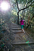 Susann Scheller running on one of the many trails of Cape Town Botanical Gardens.  Table Mountain, Cape Town, South Africa.