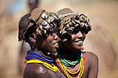 Women in the Bumi tribe decorate their hats with bottlecaps , Omo valley, Ethiopia,2010