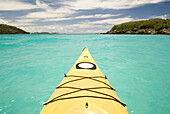 A yellow sea kayak in tropical turqoise waters near Cinnamon Cay in Virgin Islands National Park, St. John, on April 18, 2006.