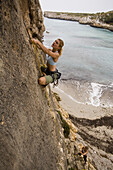 Catherine Brunel-Guitton rock climbing in Mallorca, Spain.