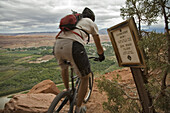 Mark Trevithick mountain biking down the Portal trail, Moab, Utah. The portal trail is know for it's exposure and cliffs. A few mountain bikers have died on this trail falling off the cliff.