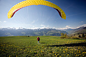 BOURG ST. MAURICE, FRANCE-April 24, 2007: A paraglider running for take off in the French Alps near Bourg St. Maurice, France on April 24, 2007. Photo by Olivier Renck/Aurora