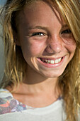 cute teenage blond girl enjoys a day at the beach with surf board releasecode:20070818-NicoleEnglish.jpg