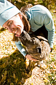 Tina Sommer gets a lick on the chin from her dog, Roxy after taking a break while trail running in the cool fall season near Santa Fe, New Mexico.