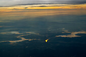 The Smokey Mountains near Knoxville Tennessee. The photos were made just before and just after sunrise from an airplane about 700 feet from the ground.The river beds are lined with fog.