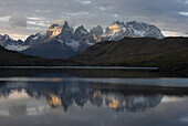 The Cuernos del Paine, or Paine Horns, peek from the mist at Torres del Paine National Park in Southern Chile.