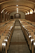 Wine ages in barrel in Piedmont, Italy.