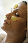 A facial treatment using grapes at Vinotherapie Spa at Relais San Maurizio in the Asti Zone, in Santo Stefano Belbo, Piedmont, Italy.  model release code: Bruso_Paola.jpg and property release code: Relais_San_Maurizio_PropertyRelease.jpg
