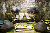 Workers file down the rough side of yellow dyed sheep skins at the Berber leather tannery in Fes El-Bali, Morocco, on October 31, 2007.