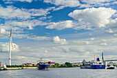 Ships on river Elbe with the Koehlbrandbruecke bridge in the background, river Elbe, Hamburg, Germany