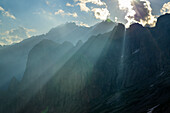 Beams of light over pinnacles, Sentiero Roma, Bergell range, Lombardy, Italy