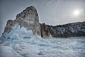 Rough ice formed at Shaman Rock, Olkhon Island as the waves freeze at the beginning of winter, Lake Baikal, Irkutsk Oblast, Siberia, Russia, Eurasia