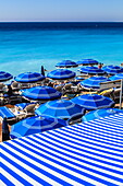 Beach parasols, Nice, Alpes Maritimes, Provence, Cote d'Azur, French Riviera, France, Europe