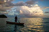 A man in a dug out canoe, Solomon Islands, Pacific