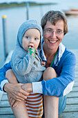 Mother and daughter (1 year) on a jetty, Gedser, Falster, Denmark