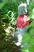 Stone statue in Japanese ornamental garden