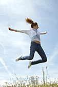 Woman jumping in midair