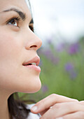 Woman looking up, close-up of face