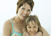Mother and daughter wearing swimsuits, portrait