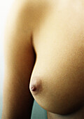 Woman's bare breast, close-up.
